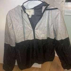 Black and grey zip up windbreaker jacket